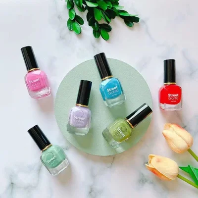 The nail polish bottles come in various shapes and styles, with color spraying and logo printing