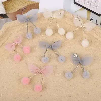 The pointed yarn is tied with a hanging ball