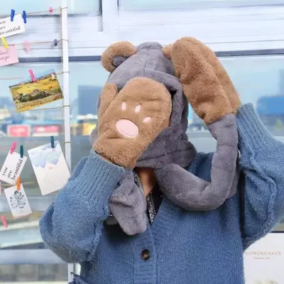 The hat is a versatile piece for women in autumn and winter. It features cute bear ears, hooded gloves and scarves. It's a three-piece set for warmth and is available for wholesale