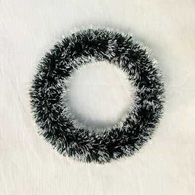 A dark green garland with white edges